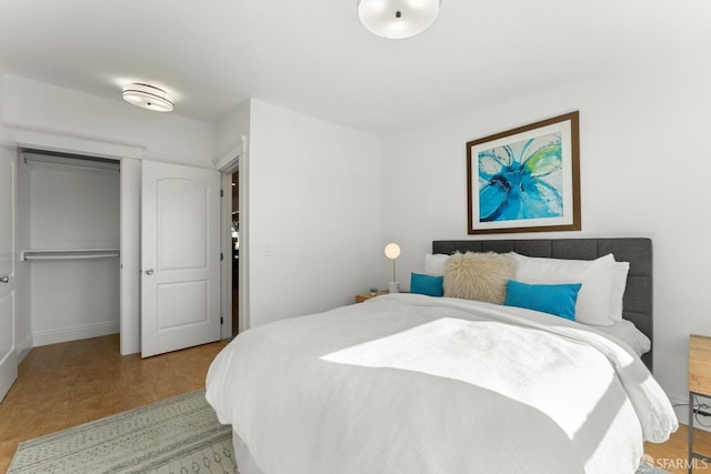 bedroom featuring light hardwood / wood-style floors and a closet