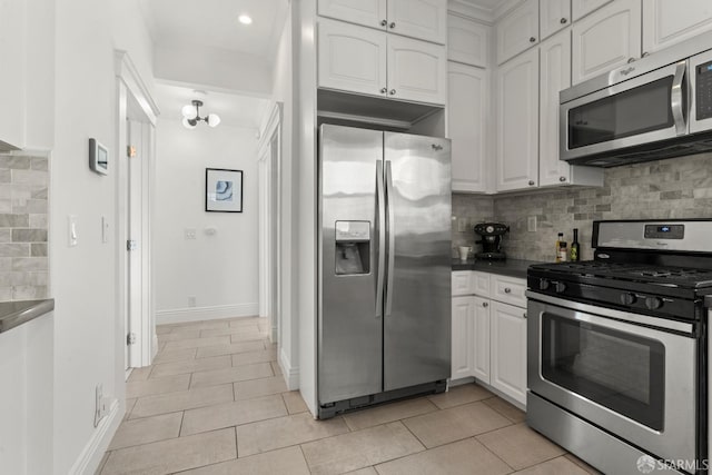 kitchen featuring decorative backsplash, white cabinets, light tile patterned floors, and appliances with stainless steel finishes