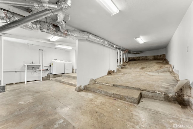 basement with washer and clothes dryer