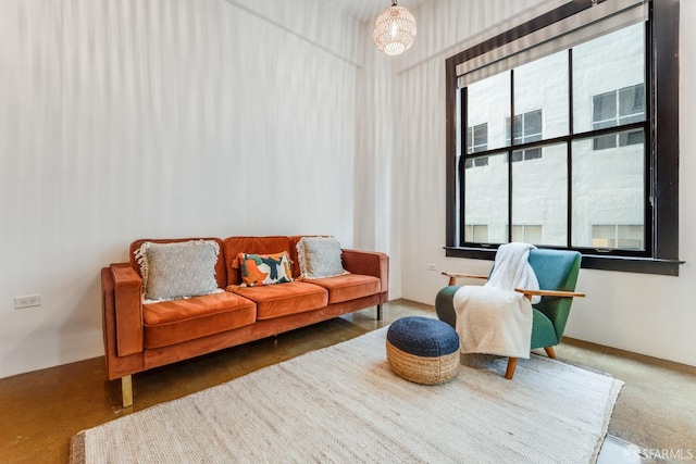 living area featuring a notable chandelier