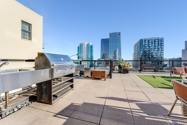 view of patio / terrace with exterior kitchen, sink, and grilling area