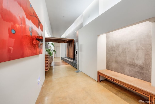 hallway with concrete floors