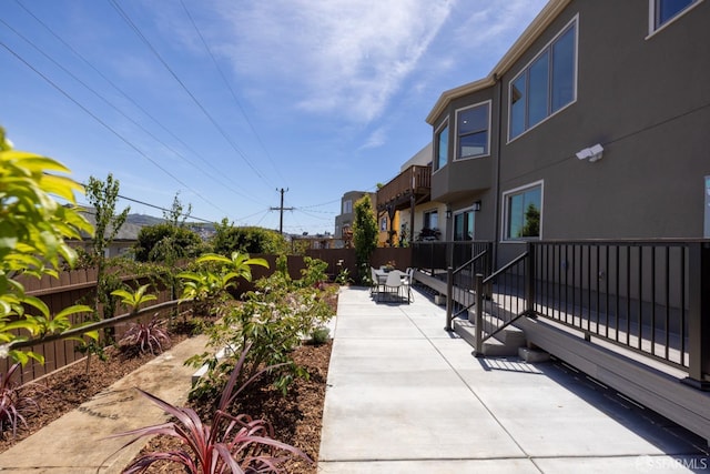 surrounding community featuring a patio area and a fenced backyard