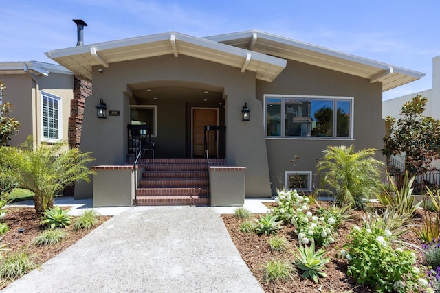 view of front of property with stucco siding and a porch