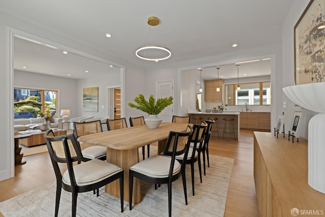 dining room featuring light wood-style floors and recessed lighting
