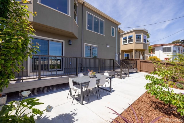 view of patio / terrace featuring fence and outdoor dining area