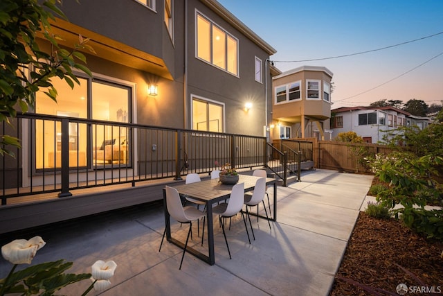 view of patio / terrace featuring fence and outdoor dining space