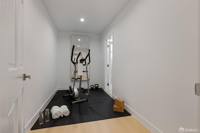 workout area with baseboards and recessed lighting