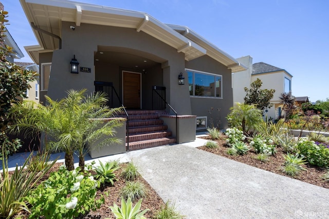 view of front of property with stucco siding and covered porch