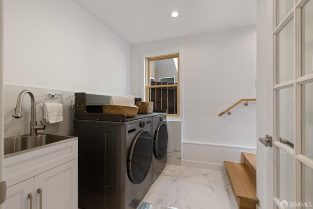washroom with independent washer and dryer, marble finish flooring, cabinet space, and recessed lighting