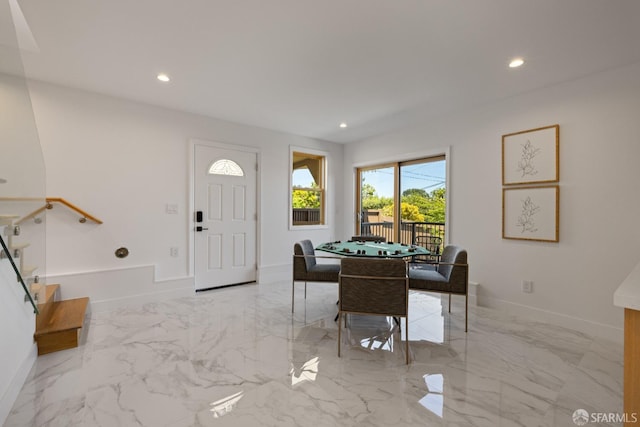 rec room featuring baseboards, marble tiled flooring, and recessed lighting