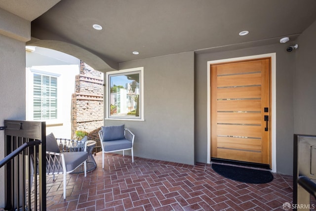 property entrance featuring stucco siding