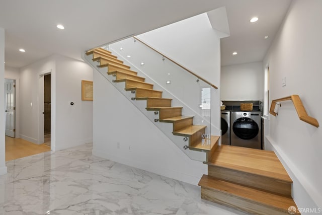 stairs with washing machine and dryer, recessed lighting, baseboards, and marble finish floors