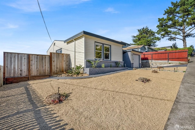 view of front of home with a garage