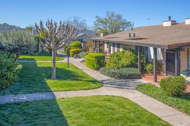 surrounding community with a yard