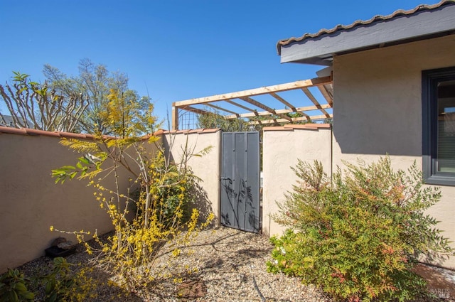 exterior space with a gate