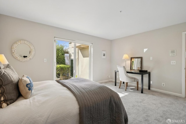 bedroom with access to outside, baseboards, and carpet flooring