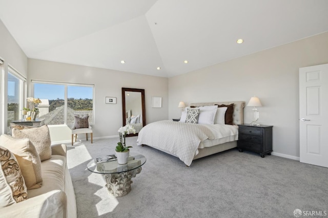 bedroom featuring light carpet, vaulted ceiling, and baseboards