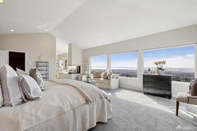 bedroom with baseboards, ensuite bathroom, carpet, high vaulted ceiling, and recessed lighting