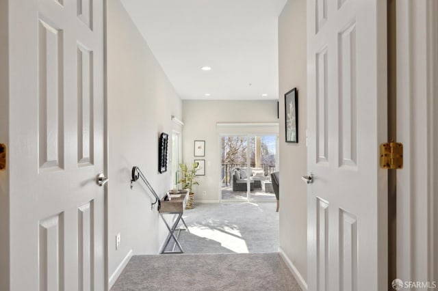 hallway with baseboards, carpet flooring, and recessed lighting