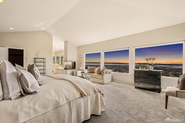 bedroom featuring baseboards, connected bathroom, carpet, vaulted ceiling, and recessed lighting