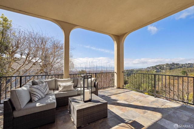 view of patio with a balcony and an outdoor hangout area