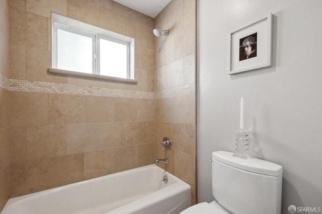 bathroom with toilet and shower / bath combination