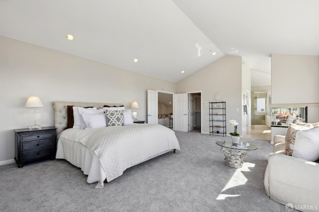 bedroom with a spacious closet, ensuite bathroom, light carpet, high vaulted ceiling, and baseboards