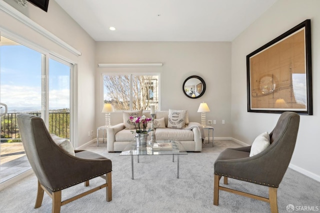 living room with carpet floors, baseboards, and recessed lighting