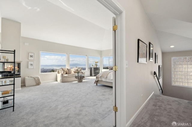 interior space with lofted ceiling, recessed lighting, and baseboards