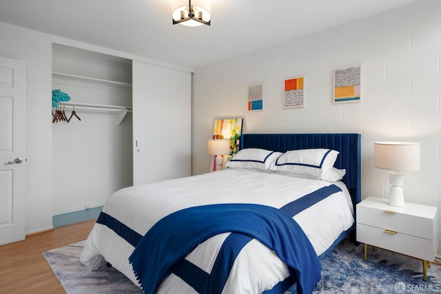 1520 Ofarrell St Unit 4, San Francisco, CA 94115 - bedroom featuring a closet, wood finished floors, and a chandelier