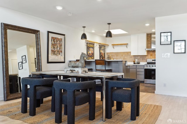 dining room with light hardwood / wood-style flooring