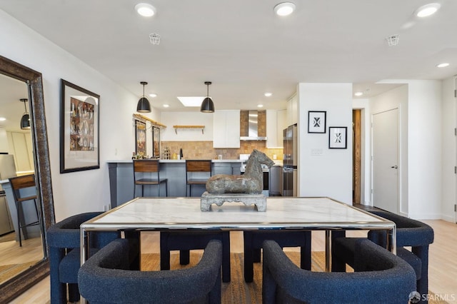 dining room featuring light hardwood / wood-style flooring