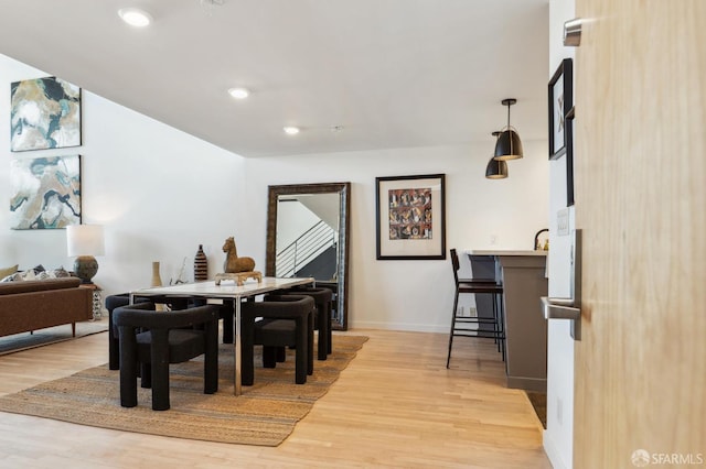 dining area featuring light wood-type flooring