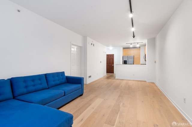 1843 Sutter St Unit 301, San Francisco, CA 94109 - unfurnished living room featuring track lighting, light wood-type flooring, and baseboards