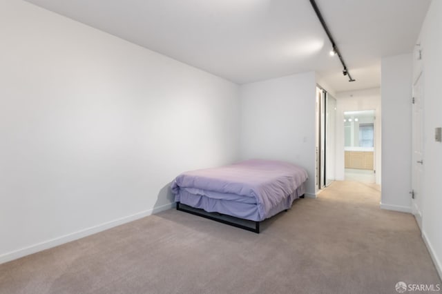 1843 Sutter St Unit 301, San Francisco, CA 94109 - carpeted bedroom with track lighting and baseboards