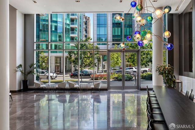 318 Main St Unit 4E, San Francisco, CA 94105 - community lobby featuring expansive windows and a high ceiling