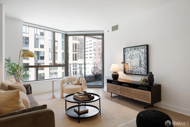 318 Main St Unit 4E, San Francisco, CA 94105 - living area featuring plenty of natural light and wood finished floors