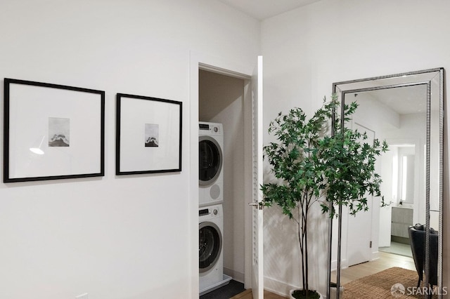 318 Main St Unit 4E, San Francisco, CA 94105 - washroom with stacked washer and clothes dryer and light wood finished floors