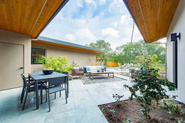 view of patio featuring an outdoor living space and outdoor dining area