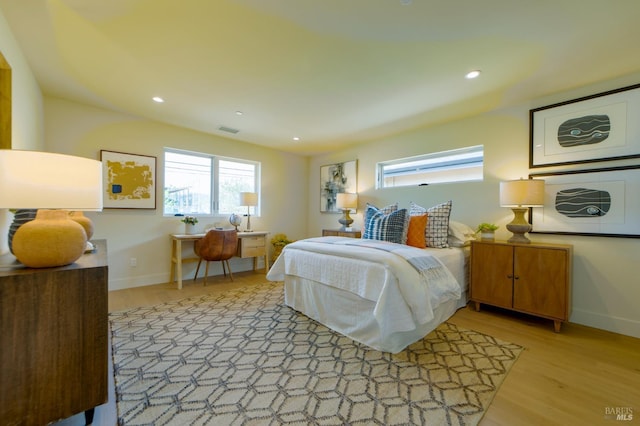 bedroom with recessed lighting, visible vents, baseboards, and light wood-style flooring