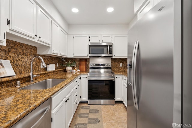 855 La Playa St Unit 360, San Francisco, CA 94121 - kitchen featuring stainless steel appliances, dark stone counters, white cabinets, tasteful backsplash, and recessed lighting