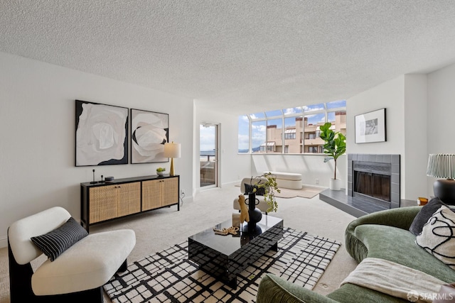 855 La Playa St Unit 360, San Francisco, CA 94121 - living room featuring carpet flooring, a tiled fireplace, and a textured ceiling