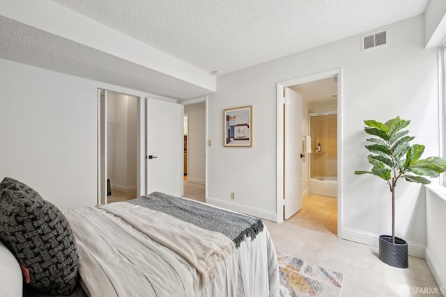 855 La Playa St Unit 360, San Francisco, CA 94121 - bedroom with light colored carpet, a textured ceiling, and ensuite bathroom