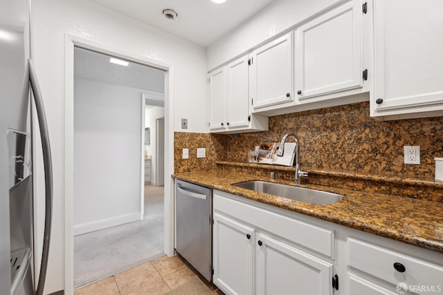 855 La Playa St Unit 360, San Francisco, CA 94121 - kitchen with stainless steel dishwasher, refrigerator with ice dispenser, light carpet, and white cabinetry