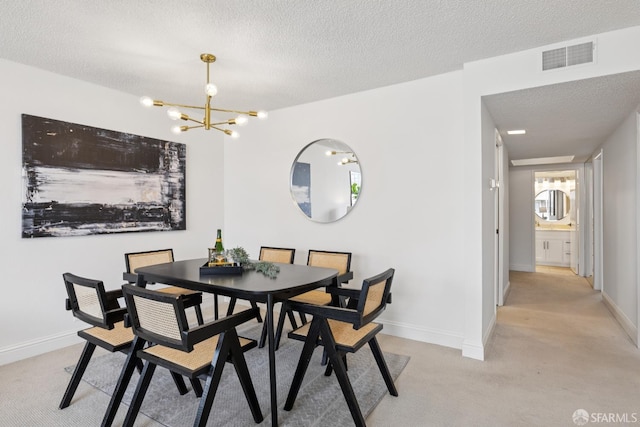 855 La Playa St Unit 360, San Francisco, CA 94121 - dining space featuring light colored carpet, a chandelier, and a textured ceiling