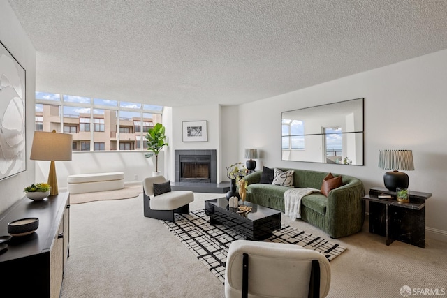 855 La Playa St Unit 360, San Francisco, CA 94121 - carpeted living area with healthy amount of natural light, a fireplace with raised hearth, and a textured ceiling