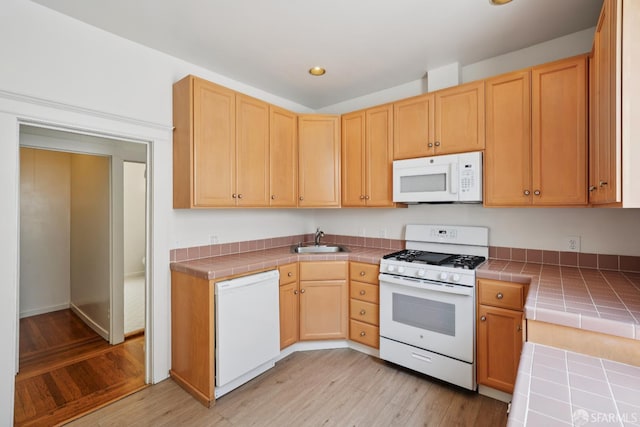 3046-3048 Polk St, San Francisco, CA 94109 - kitchen with white appliances, tile countertops, light wood-style flooring, and recessed lighting