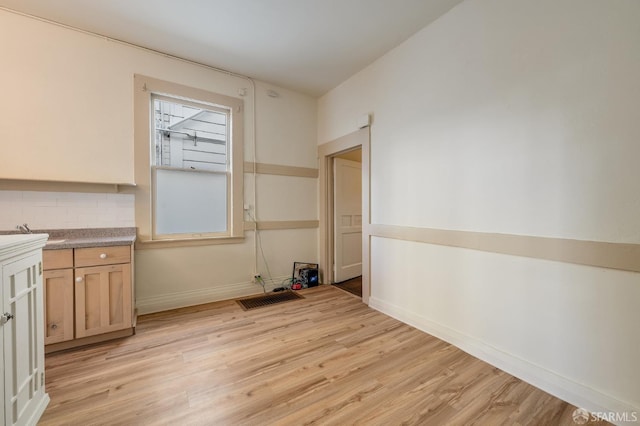 3046-3048 Polk St, San Francisco, CA 94109 - unfurnished dining area with light wood-type flooring and baseboards