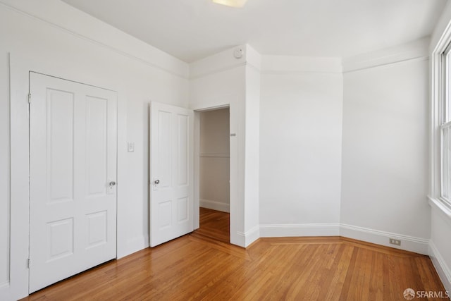 3046-3048 Polk St, San Francisco, CA 94109 - unfurnished bedroom with light wood-style flooring and multiple windows